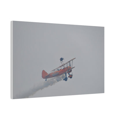Single Wing Walker Flying From The Left With Side View Ascending, With Smoke And Person Laying Sideways Close Up, Matte Canvas, Stretched, 0.75" - The Trio Synergize Group