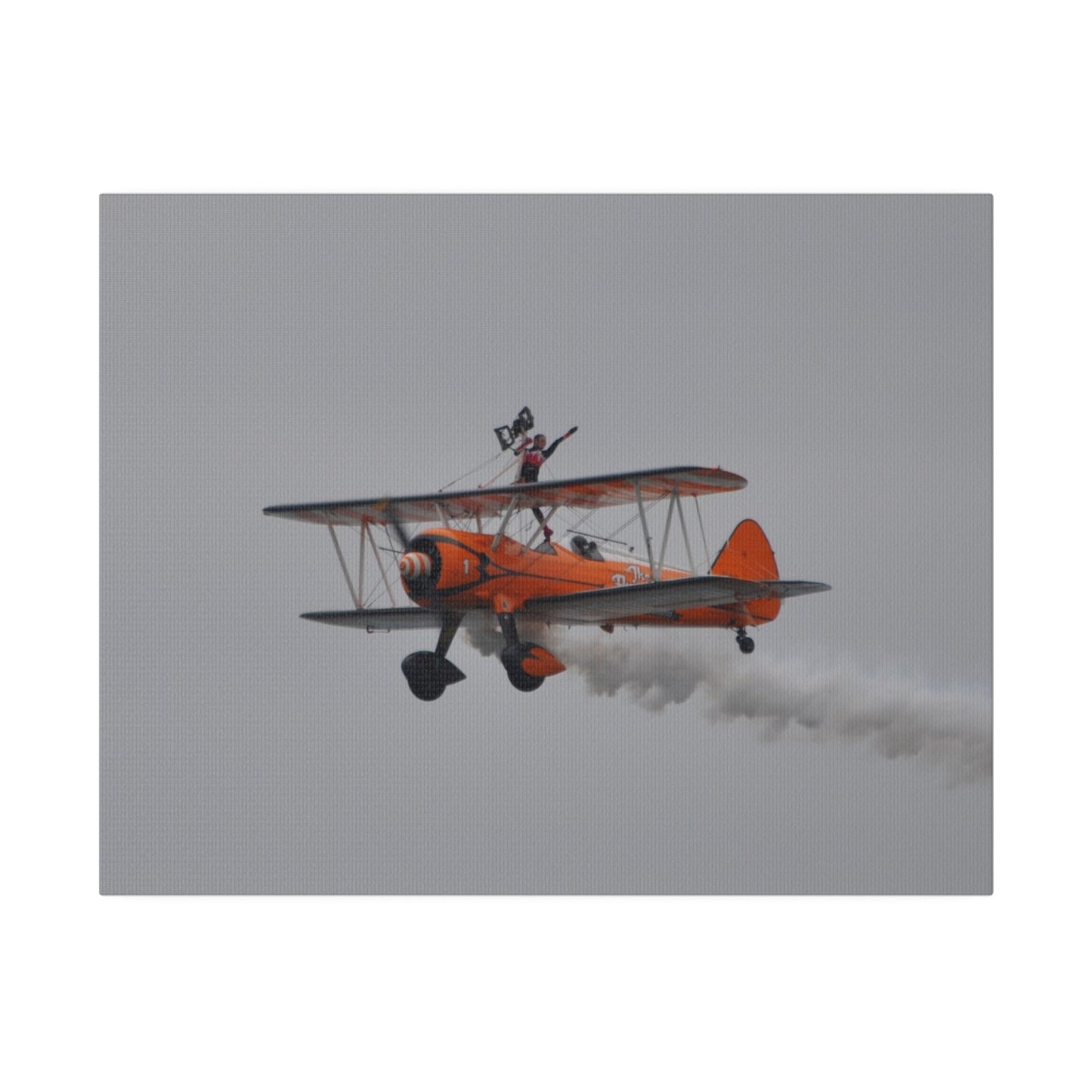 Single Wing Walker Flying From The Right, Front Side View Much Closer Up, Person Standing Without The Harness With Left Arm Out, With Smoke, Matte Canvas, Stretched, 0.75" - The Trio Synergize Group
