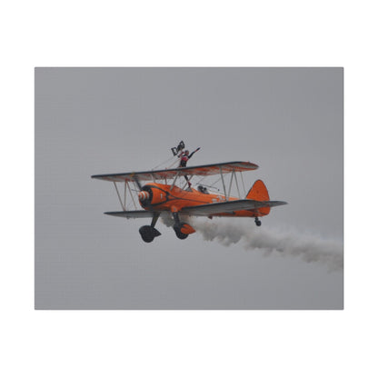 Single Wing Walker Flying From The Right, Front Side View Much Closer Up, Person Standing Without The Harness With Left Arm Out, With Smoke, Matte Canvas, Stretched, 0.75" - The Trio Synergize Group
