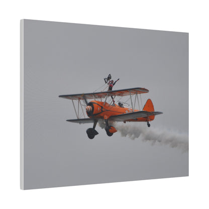 Single Wing Walker Flying From The Right, Front Side View Much Closer Up, Person Standing Without The Harness With Left Arm Out, With Smoke, Matte Canvas, Stretched, 0.75" - The Trio Synergize Group