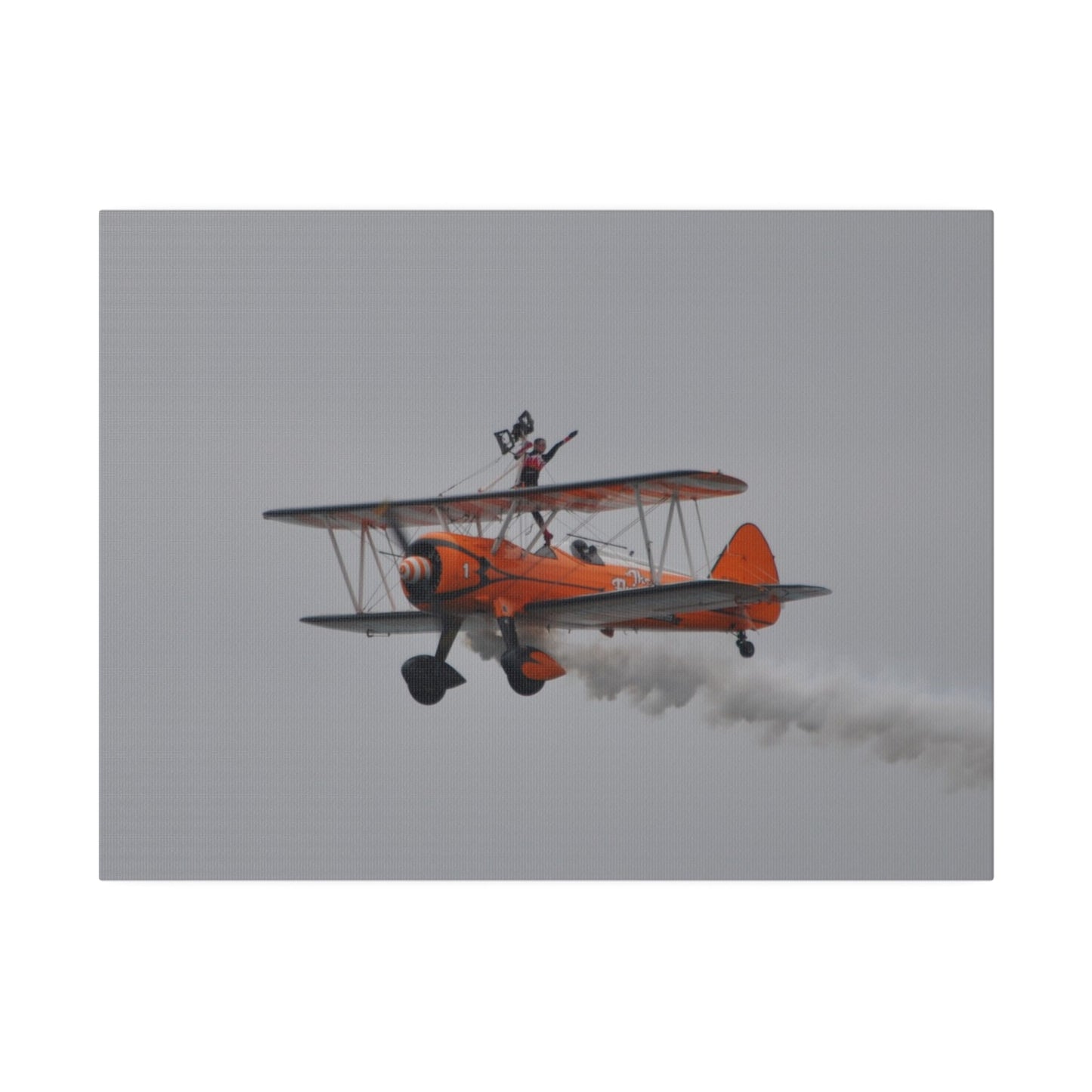 Single Wing Walker Flying From The Right, Front Side View Much Closer Up, Person Standing Without The Harness With Left Arm Out, With Smoke, Matte Canvas, Stretched, 0.75" - The Trio Synergize Group