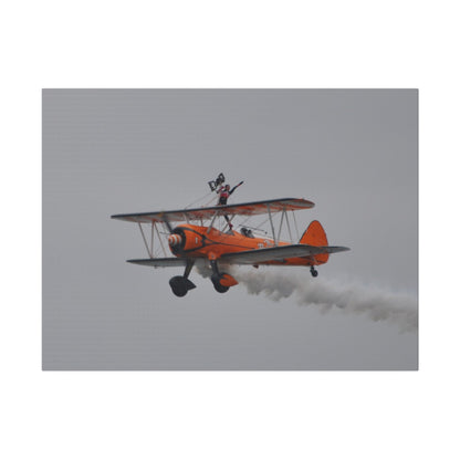Single Wing Walker Flying From The Right, Front Side View Much Closer Up, Person Standing Without The Harness With Left Arm Out, With Smoke, Matte Canvas, Stretched, 0.75" - The Trio Synergize Group