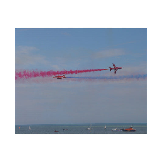 The Red Arrows Crossing Each Other Over The Sea Canvas - The Trio Synergize Group